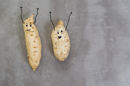 Great concept of healthy eating, sweet potato on gray background, polished concrete.の写真素材