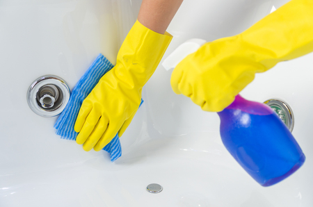 Great concept of domestic cleaning, hand with glove cleaning bath.の写真素材