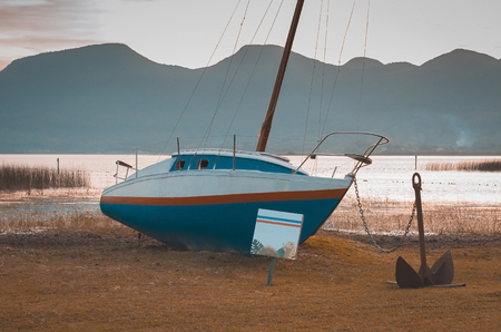 Sailboat anchored on the beach, lagoon of Brazil.の写真素材