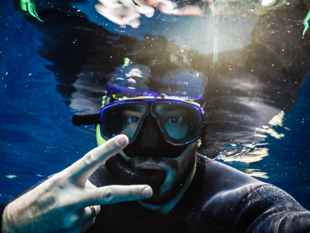 Practicing diving and snorkeling, mysterious lagoon, beautiful lagoon of transparent turquoise blue water, located in the city of Bonito, Mato Grosso do Sul, Brazilの写真素材