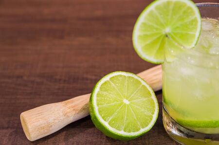 Caipirinha, traditional Brazilian alcoholic drink, typical drink made with sugar, lemon, distilled cane (cachaca) and ice.の写真素材