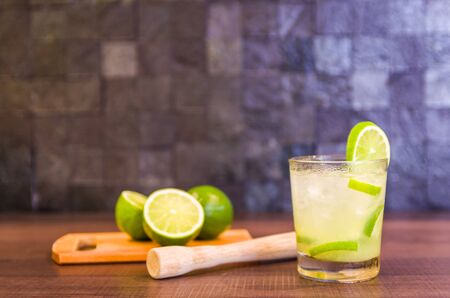 Caipirinha, traditional Brazilian alcoholic drink, typical drink made with sugar, lemon, distilled cane (cachaca) and ice.の写真素材