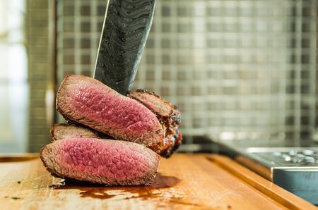 Beautiful photo of beef brisket (Brisket point end). Meat cut with forged Damascus steel knife Arkansas Breeze style.の写真素材