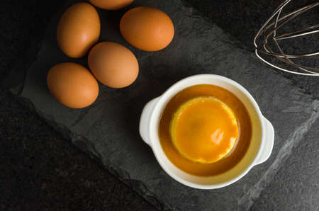 Traditional Brazilian dessert, milk pudding on dark background.の写真素材