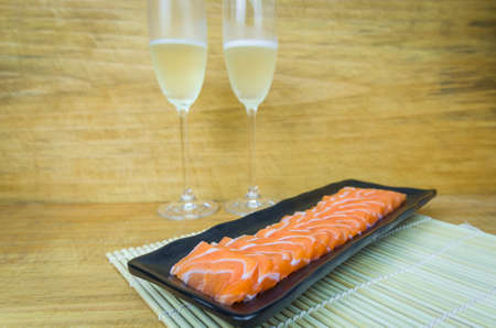 Traditional salmon carpaccio with olive oil sauce and lemon juiceの写真素材