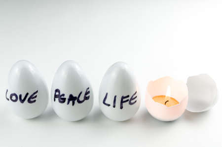 Easter, the time of Christ's resurrection, celebration of life, Easter eggs with candlelight.の写真素材