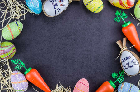 Colorful Easter eggs and other objects on a trendy black background for various Easter themed...