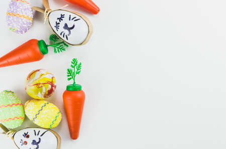 Colorful Easter eggs and other objects on a trendy white background for various Easter themed backgroundsの写真素材