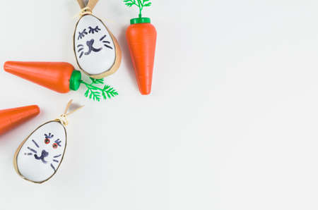 Colorful Easter eggs and other objects on a trendy white background for various Easter themed backgroundsの写真素材