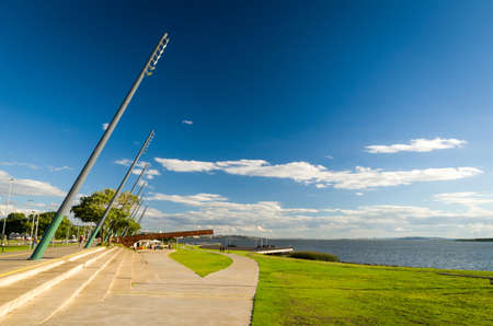 Porto Alegre, Rio Grande do Sul, Brazil, March 29 - 2021: Beautiful sunset on the edge of GuaÃ­ba, Gasometro at golden hourのeditorial素材