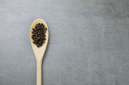 black pepper spice in wooden spoonの写真素材