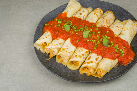 Brazilian pancakes with chicken, tomato bolognese sauce, rolled pancakes.の写真素材