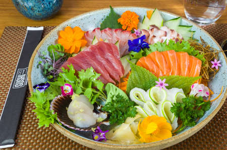 Platter decorated with different flavors of elegant sashimi sushi, salmon, tuna, halibut, burnt salmon. Selective focus.の写真素材