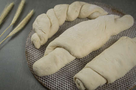 Sourdough bread fermenting, gray background with dried wheat flowerの写真素材