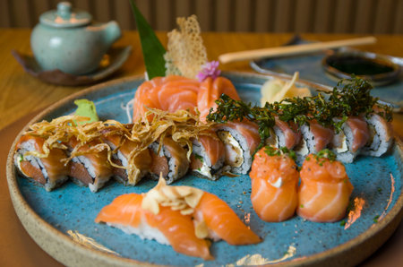 Combined of differents japanese sushi on an elegant blue plate.の写真素材