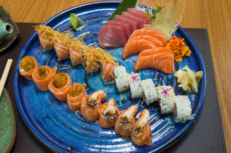 Combined of differents japanese sushi on an elegant blue plate.の写真素材