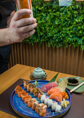 Combined of differents japanese sushi on an elegant blue plate.の写真素材