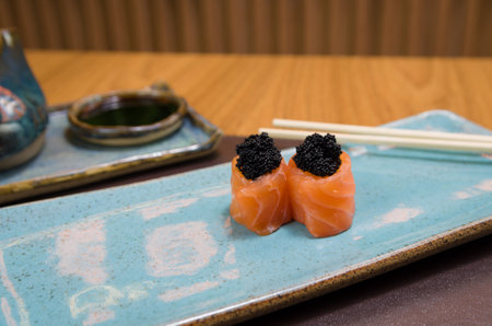 Combined of differents japanese sushi on an elegant blue plate.の写真素材