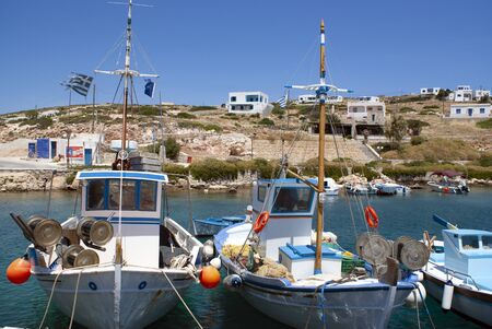 Traditional, colorful wooden fishing boats at harbor on the Greek island of Donoussa. A quiet, small island in the Cyclades, in the Aegean sea.の写真素材