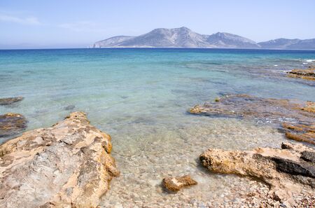 Greece â Koufonissi island. Crystal clear blue seas. A view to the nearby island of Kerosの写真素材