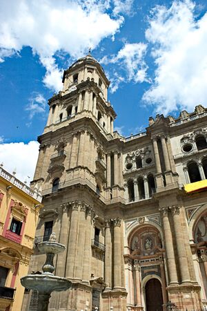 A view of the beautiful facade of Malaga cathedral in southern spain.  An ornate baroque frontage to a gothic monument.の写真素材