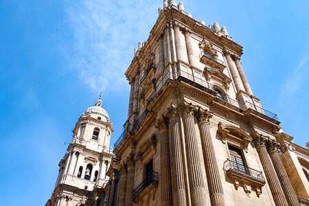 Malaga cathedral in Andalusia. An ornate building in both the Renaissance and Baroque styles.  The unfinished south tower with the finished north tower in the background.の写真素材