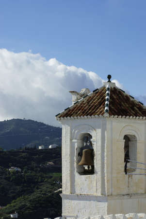 Frigiliana village Spain. Bell tower of the town church of San Antonio. Formerly the minaret of a mosque. The dramatic structure is in the heart of the old Moorish quarter.の写真素材