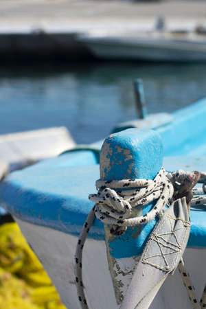Detailed view of small Greek fishing boat  Focus on foreground with blurred background for copy space Abstract composition meant to evoke the Greek islands  Vertical shotの写真素材