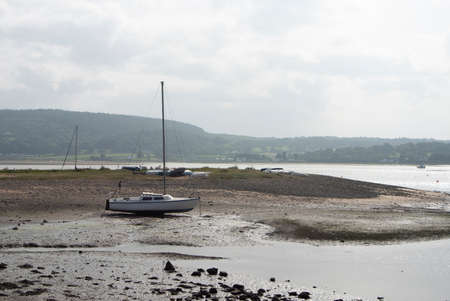 Anglesey, Wales, Red Wharf Bay. Beautiful view of the coastline at low tide with boats beached on...