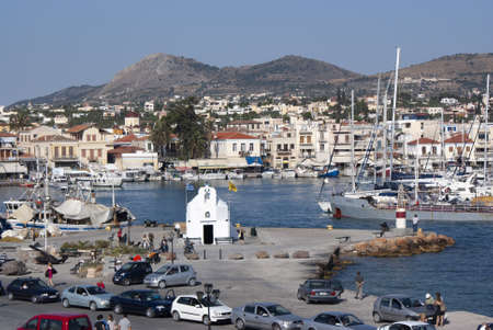 Aegina - Greece -  June 7 2009 : Beautiful colourful harbour of this charming island. Busy waterfront with boats cafes and tavernas.  Landscape aspect shot.のeditorial素材