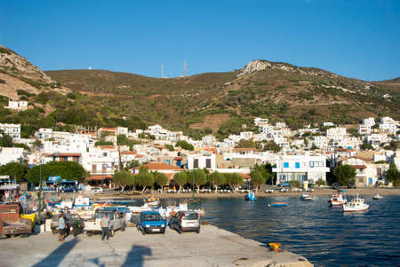 Fourni isle - Greece - September 1 2014 : Beautiful Greek island. Busy harbor and waterfront in a charming bay. Landscape aspect shot.  Copy space.のeditorial素材