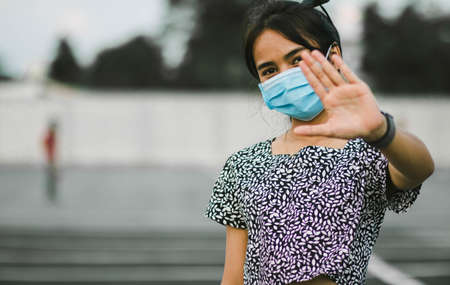 Girl with mask to protect her from Corona virus. Corona virus pandemic. Anti-virus and anti-bacteria...