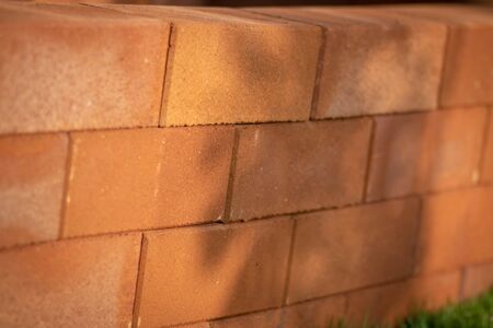 Close-up details of a orange-brown brick wall. red brick wall close up, old brick background....