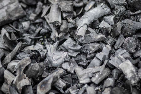Black charcoal texture background. Close-up. Charcoal is a folk wisdom.の写真素材