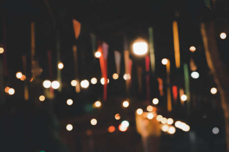 Blur the lights at the restaurant Blurred background with orange, red, light, blue, green, pink bokeh.の写真素材