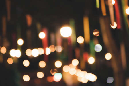 Blur the lights at the restaurant Blurred background with orange, red, light, blue, green, pink bokeh.の写真素材