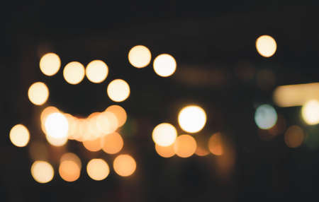 Blur the lights at the restaurant Blurred background with orange, red, light, blue, green, pink bokeh.の写真素材