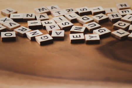 Blurred Text dice cube background. abstract blur. Text dice cube concept / Letter dices alphabet on wooden background. Block of alphabet studded on the floor. vintage style.の写真素材