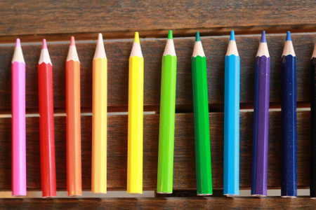 Color pencils isolated on dark table background close up with Clipping path.Beautiful color pencils.Color pencils for drawing.の写真素材