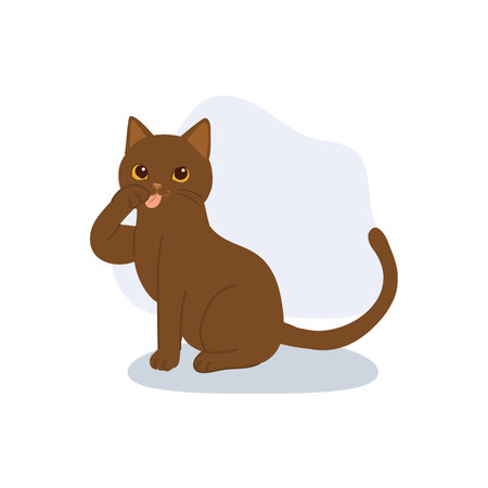 cute brown cat licking its paw while sitting showing self grooming behavior perfect for pet care or animal illustration themesのイラスト素材