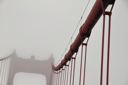 Cable to the fog - Golden Gate Bridge - San Francisco - Californiaの写真素材