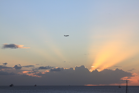Plane over the sunset - Les Trois Ilets - Martinique FWIの写真素材