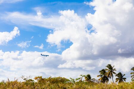 09 APR 2019 - Martinique, FWI - Plane landing at Aime Cesaire Le Lamentin Airportの写真素材
