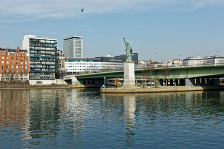 Statue of Liberty replica and Radio France building in Paris, Franceのeditorial素材