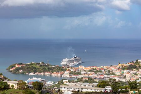 09 JAN 2020 - St George's, Grenada, West Indies - Cruise ship in front of the city of St. George'sの写真素材