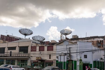 08 JAN 2020 - Port of Spain, Trinidad and Tobago - Satellite dishes over a buildingのeditorial素材