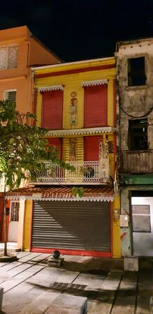 16 NOV 2019 - Fort de France, Martinique, FWI - Typical creole building at nightのeditorial素材