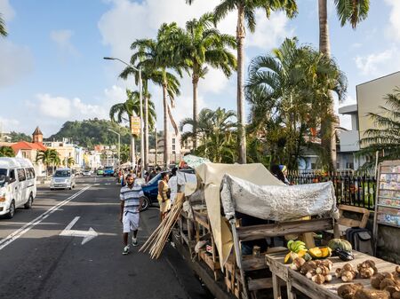 10 JAN 2020 - Kingstown, Saint Vincent and the Grenadines - Market vendors in the streetのeditorial素材