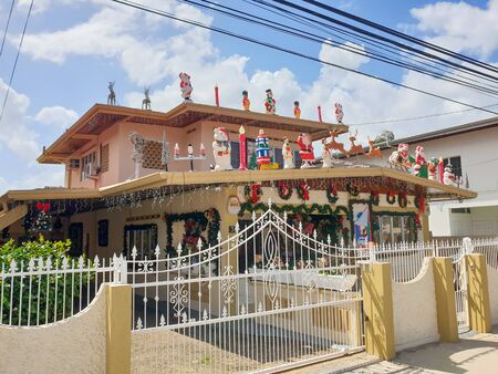 08 JAN 2020 - Port of Spain, Trinidad and Tobago - Fully decorated house for christmasのeditorial素材