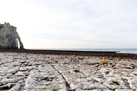 Etretat, Normandy, France - The beach at low tide, view to the 'Aval' cliffの写真素材